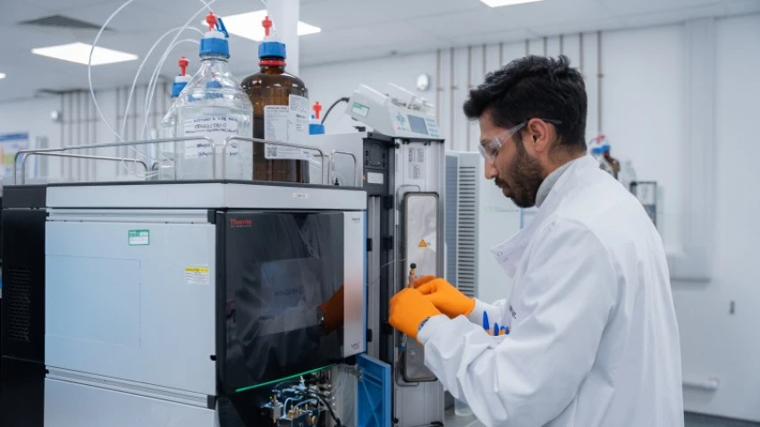 Broughton scientist working with laboratory equipment