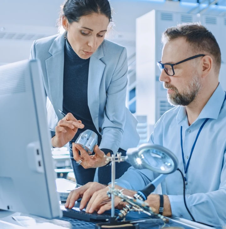 Male and female scientist conducting product testing at computer 